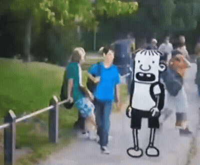 Group Walking Down Path With Cartoon Character In Background GIF