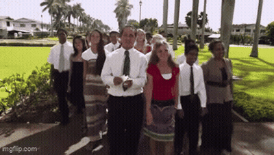 Group Walking Down Sidewalk GIF