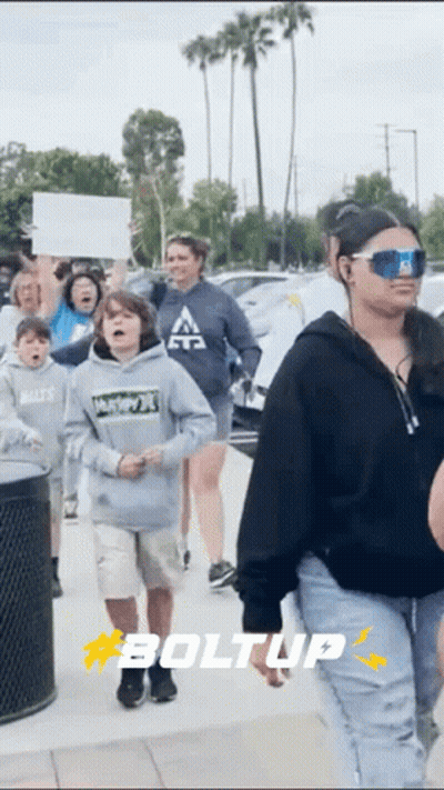 Group Walking Down Street With Boltup GIF