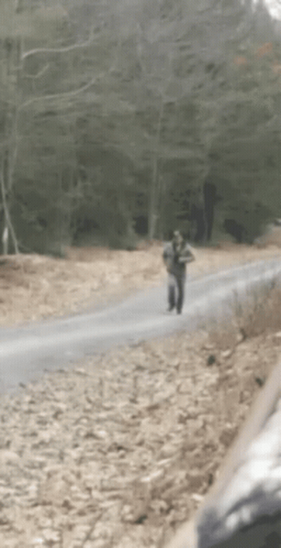Group Walking On Red Track One Jumping GIF