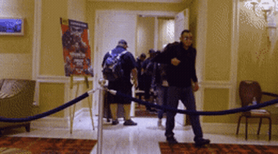 Group Walking Past Boxing Poster GIF