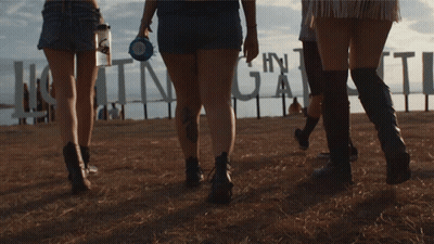 Group Walking Past Huntinggate Sign GIF