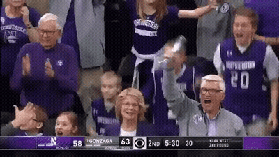 Group Watching Basketball Game Score 63 to 58