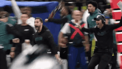 Group Watching Football Game Man Holding Sign X GIF