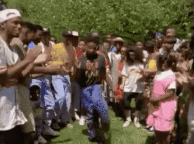 Group Watching Man Dancing In Park GIF