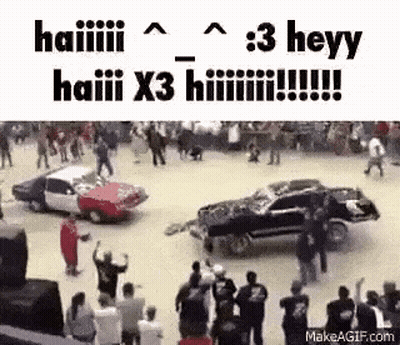 Group Watching Two Cars Crash At Race Track GIF