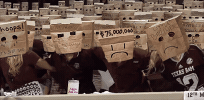 Group Wearing Paper Bags On Heads With Hoops GIF