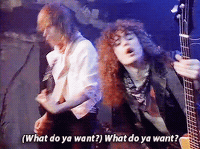 Guitarist Beside Man Saying What Do Ya Want GIF