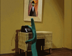 Gumby Cartoon Character Making Phone Call GIF