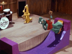 Gumby Roller Skates While Playing Guitar GIF