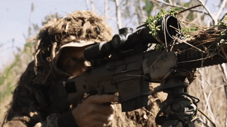 Gunner Shooting From The Bushes GIF