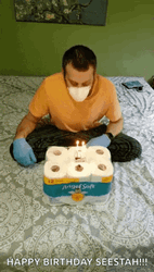 Guy Blows Candle Of Toilet Paper Cake GIF
