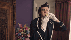 Guy Butler Eating Hands With Gloves GIF