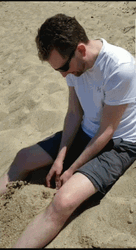 Guy Digging At The Beach GIF