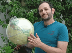 Guy Discussing Globe Features GIF