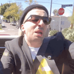 Guy Driving Spits Blah Blah Blah GIF