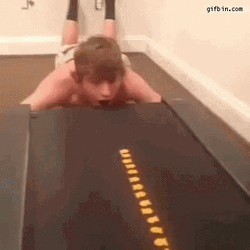 Guy Eating On A Treadmill GIF