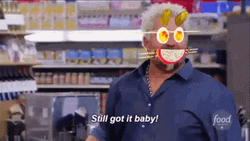 Guy Fieri With A Stick And Pickles On His Forehead GIF