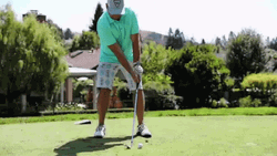 Guy Golfing In Golf Course