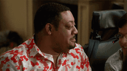 Guy In Floral Polo Holding In Laugh GIF