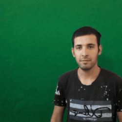 Guy In Front Of Green Wall GIF