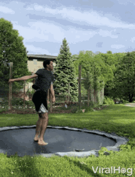 Guy Jumping And Twirling On A Trampoline GIF