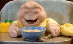 Guy Laughing While Having Breakfast GIF