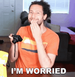 Guy Looking At Pictures Worried Reaction GIF