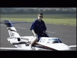 Guy Riding Small Airplane GIF