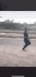 Guy Running Away Giving Dirty Finger GIF