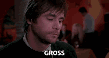 Guy Shrugs Saying Gross GIF