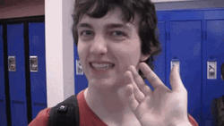 Guy Slapping Face In The Hallway GIF