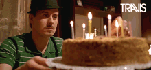 Guy Spinning Birthday Cake With Candles GIF
