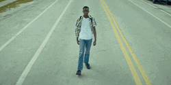 Guy Walking In The Middle Of Road GIF