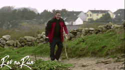 Guy Walking With Long Stick For Support GIF