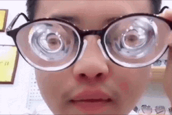 Guy Wearing Intense High Graded Glasses GIF