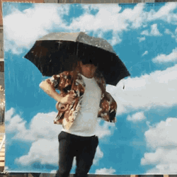 Guy With Cloud Background Dancing In The Rain GIF