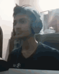 Guy With Headphones Suddenly Punching GIF