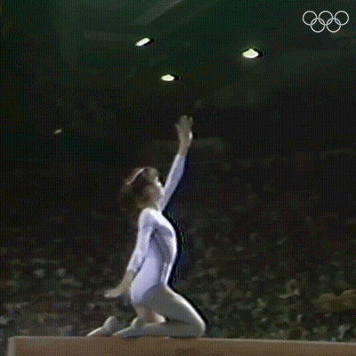 Gymnast Doing Trick On Balance Beam GIF