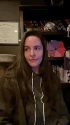 Hair Tuck Woman Wearing Hoodie GIF