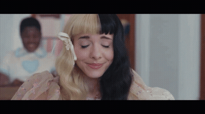 Half Black Half Blonde Woman Smiling Eyes Closed GIF