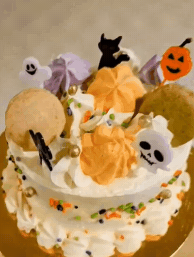 Halloween Cake With Ghosts Skulls And Pumpkins GIF