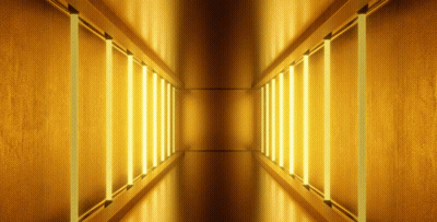 Hallway With Yellow Lights On Walls And Ceiling GIF