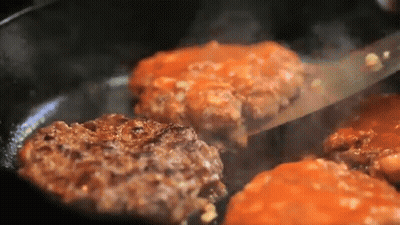 Hamburger Patties Cooking In Pan With Sauce GIF