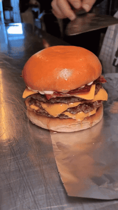 Hamburger With Cheese And Bacon On Metal Surface GIF