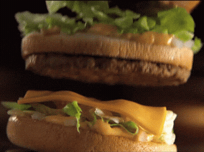 Hamburger With Lettuce And Cheese On A Bun GIF