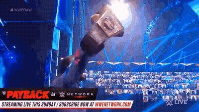 Hammer Held Up At Wrestling Event GIF