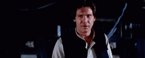Han Solo Wearing Black Vest And White Shirt GIF