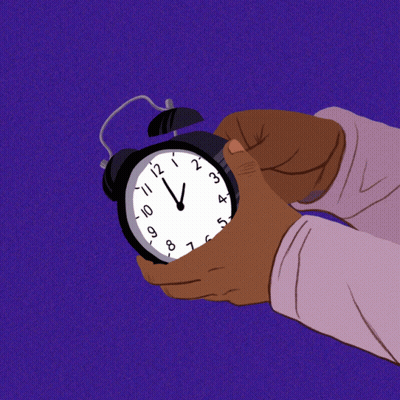 Hand Holding Alarm Clock At 12 And 1 GIF