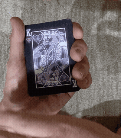 Hand Holding Black King Card GIF